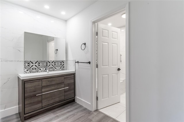 272 Fairway Cir Unit 98, Weston, FL 33326 - full bathroom featuring vanity, wood finished floors, and recessed lighting