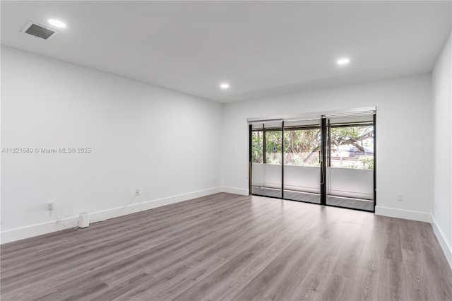 272 Fairway Cir Unit 98, Weston, FL 33326 - empty room with wood finished floors and recessed lighting