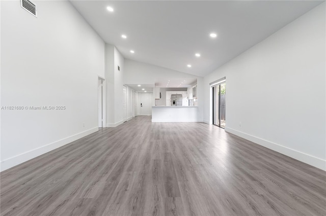 272 Fairway Cir Unit 98, Weston, FL 33326 - unfurnished living room with recessed lighting, wood finished floors, and high vaulted ceiling