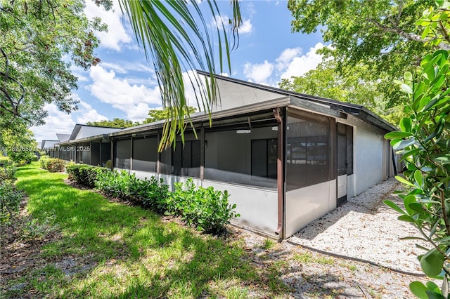 272 Fairway Cir Unit 98, Weston, FL 33326 - view of side of home featuring a sunroom