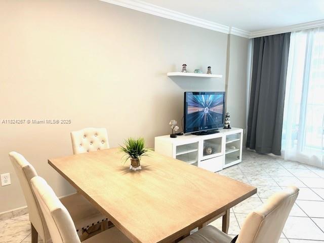 3505 S Ocean Dr Unit 419, Hollywood, FL 33019 - dining area with ornamental molding and tile patterned flooring