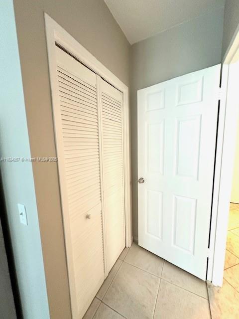 3505 S Ocean Dr Unit 419, Hollywood, FL 33019 - unfurnished bedroom featuring a closet and light tile patterned flooring