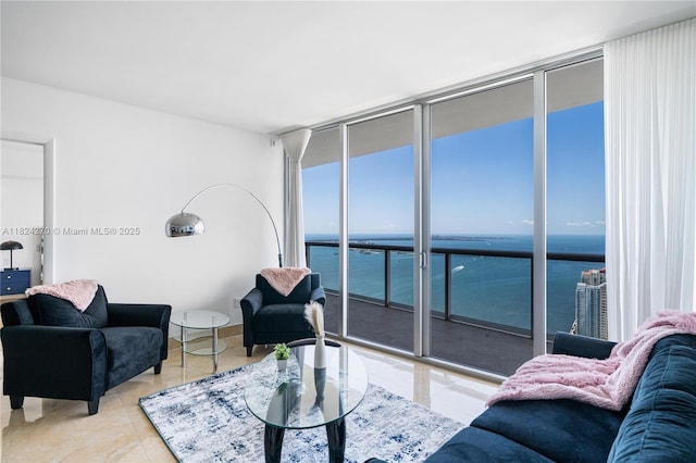 495 Brickell Unit 5705, Miami, FL 33131 - tiled living area with a wall of windows and a water view