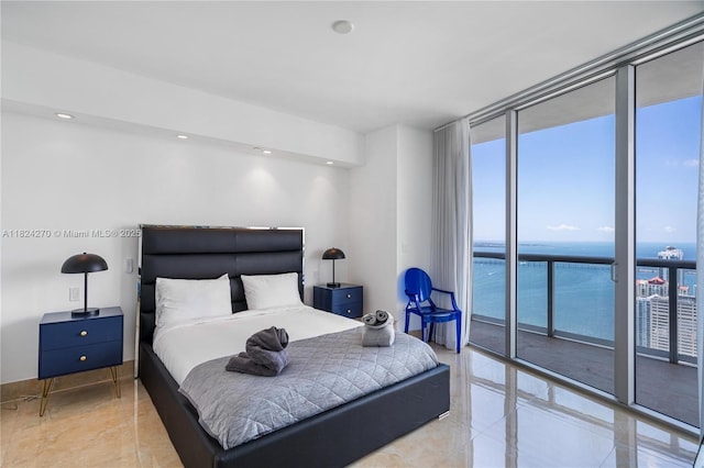 495 Brickell Unit 5705, Miami, FL 33131 - bedroom featuring expansive windows, multiple windows, and light tile patterned floors