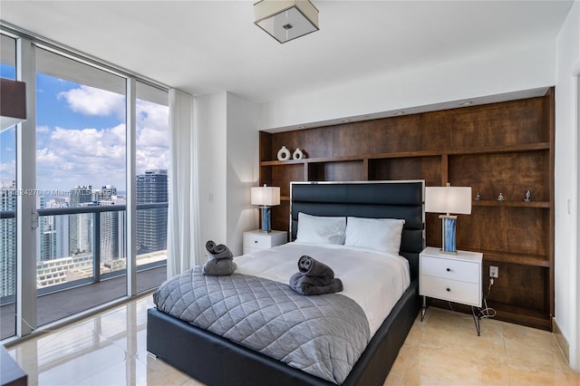 495 Brickell Unit 5705, Miami, FL 33131 - bedroom with expansive windows, multiple windows, access to outside, and a city view