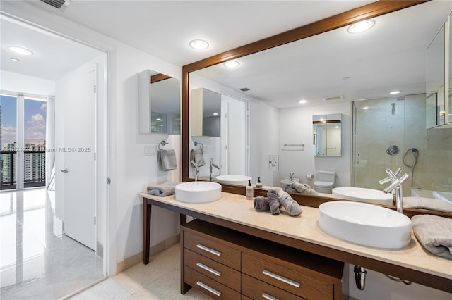 495 Brickell Unit 5705, Miami, FL 33131 - full bath with a stall shower, double vanity, recessed lighting, and tile patterned floors