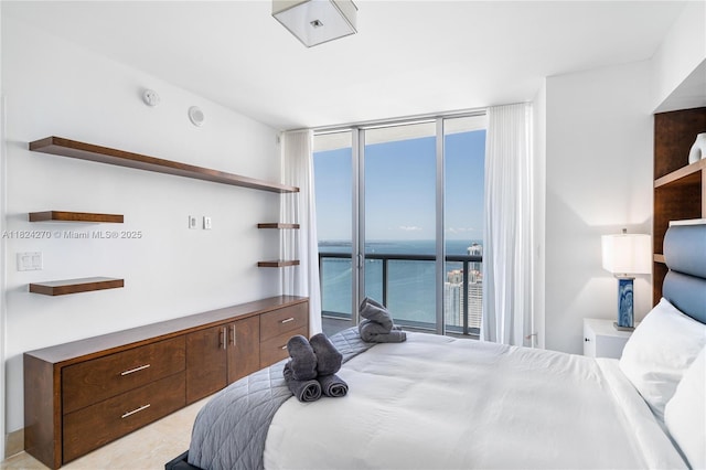 495 Brickell Unit 5705, Miami, FL 33131 - bedroom featuring floor to ceiling windows and access to exterior