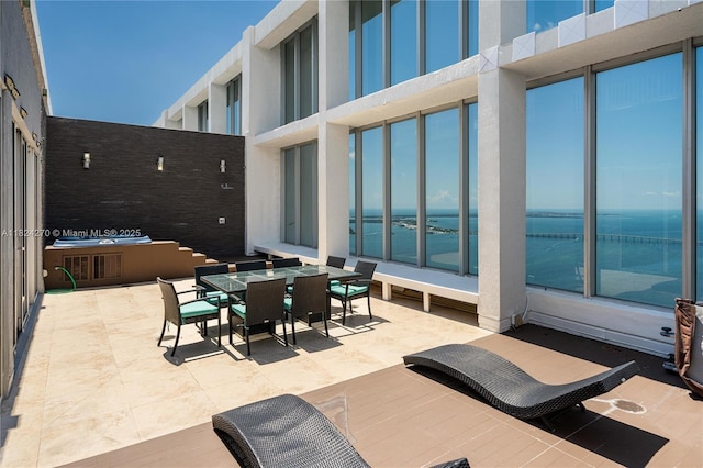 495 Brickell Unit 5705, Miami, FL 33131 - view of patio / terrace featuring outdoor dining space and a water view