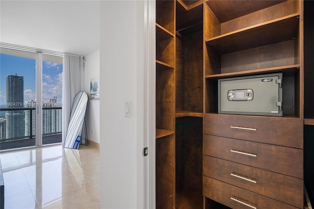 495 Brickell Unit 5705, Miami, FL 33131 - spacious closet featuring light tile patterned flooring