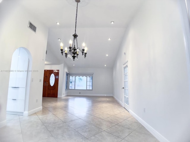 14332 SW 38th Ter, Miami, FL 33175 - entrance foyer with high vaulted ceiling, light tile patterned floors, a chandelier, arched walkways, and recessed lighting