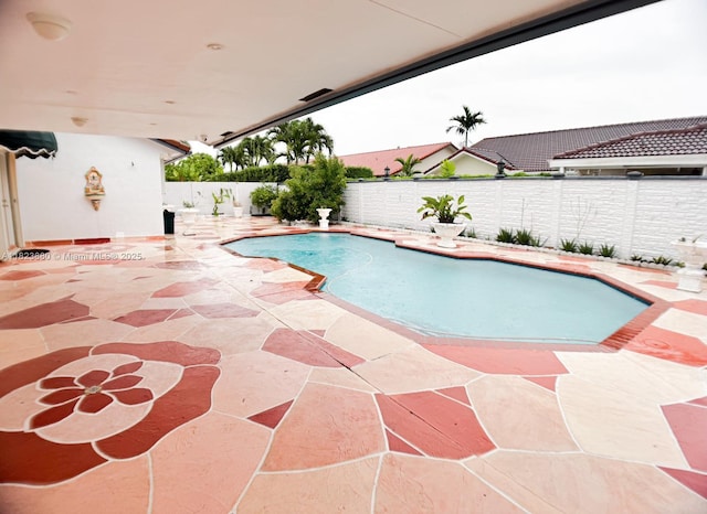 14332 SW 38th Ter, Miami, FL 33175 - view of swimming pool featuring a patio area and a fenced backyard