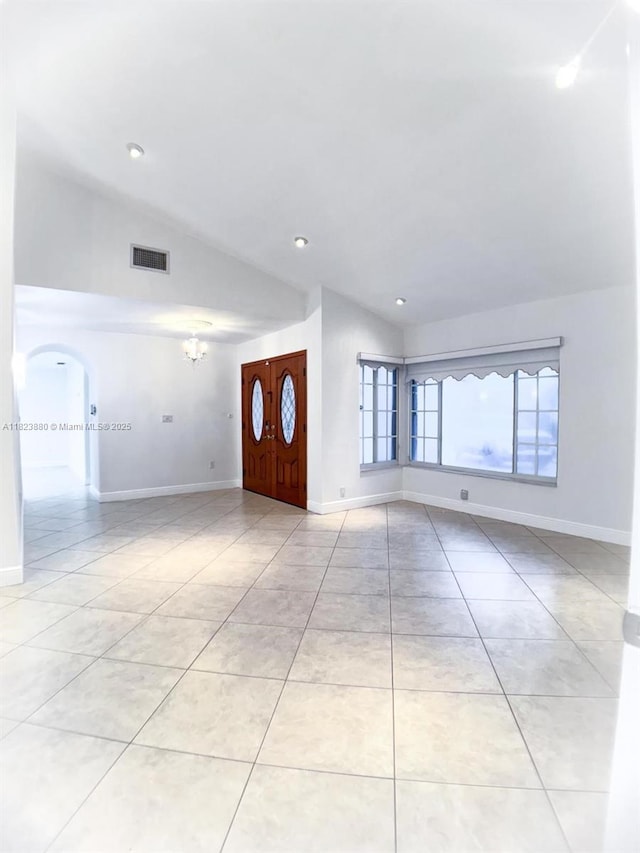 14332 SW 38th Ter, Miami, FL 33175 - unfurnished living room featuring vaulted ceiling, a chandelier, light tile patterned floors, arched walkways, and recessed lighting