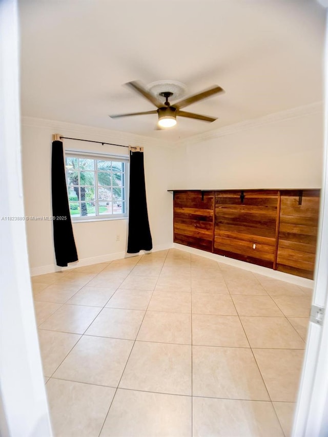 14332 SW 38th Ter, Miami, FL 33175 - spare room with light tile patterned flooring, ceiling fan, and crown molding