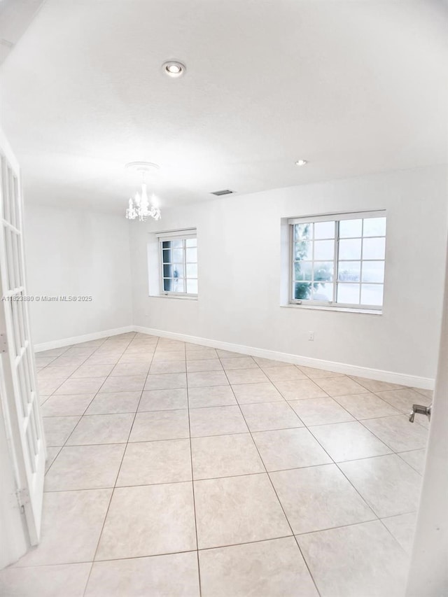 14332 SW 38th Ter, Miami, FL 33175 - spare room with a chandelier, light tile patterned flooring, and recessed lighting