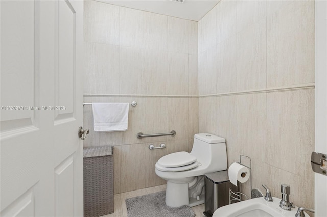 2425 SW 27th Ave Unit 705, Miami, FL 33145 - bathroom featuring tile walls, a bidet, and tile patterned floors