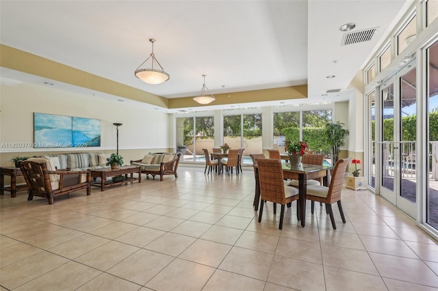 2425 SW 27th Ave Unit 705, Miami, FL 33145 - dining room with light tile patterned floors and a raised ceiling