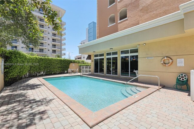 2425 SW 27th Ave Unit 705, Miami, FL 33145 - community pool featuring a patio