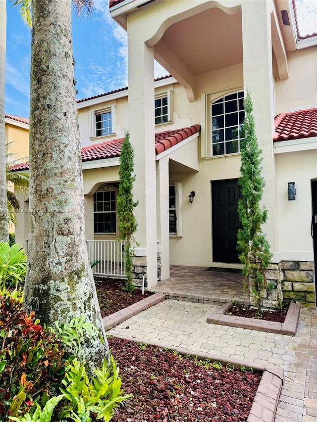 1325 Chenille Cir, Weston, FL 33327 - view of front of house featuring a tiled roof and stucco siding