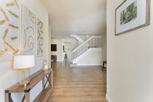 3324 W 90, Hialeah, FL 33018 - entrance foyer featuring wood finished floors, stairway, and arched walkways