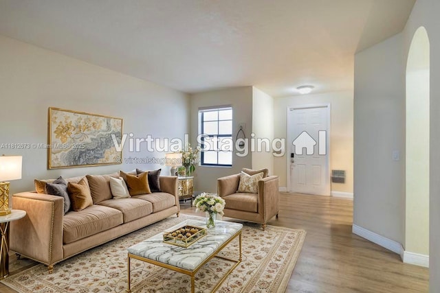 3324 W 90, Hialeah, FL 33018 - living area featuring arched walkways and light wood-style flooring
