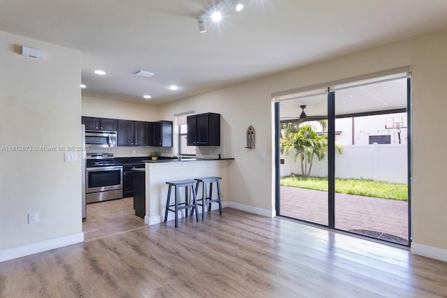 3324 W 90, Hialeah, FL 33018 - kitchen with stainless steel appliances, plenty of natural light, light wood-style flooring, and recessed lighting