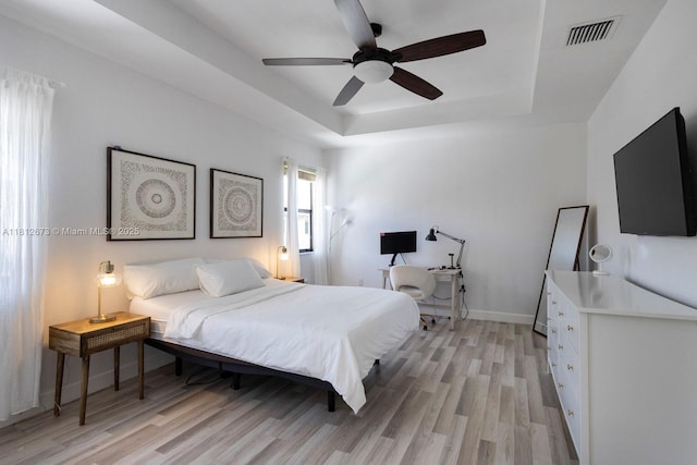 3324 W 90, Hialeah, FL 33018 - bedroom with light wood finished floors, a tray ceiling, and a ceiling fan