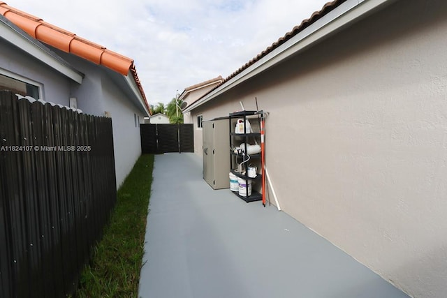 3813 SW 149th Pl, Miami, FL 33185 - view of side of property featuring stucco siding and a tiled roof