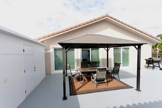 3813 SW 149th Pl, Miami, FL 33185 - view of patio with a gazebo, outdoor dining space, and grilling area