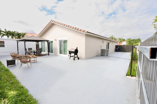3813 SW 149th Pl, Miami, FL 33185 - rear view of property with a gazebo, stucco siding, a patio area, and a tiled roof