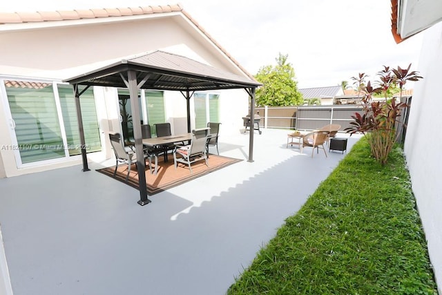 3813 SW 149th Pl, Miami, FL 33185 - fenced backyard featuring a gazebo, a patio area, and outdoor dining area