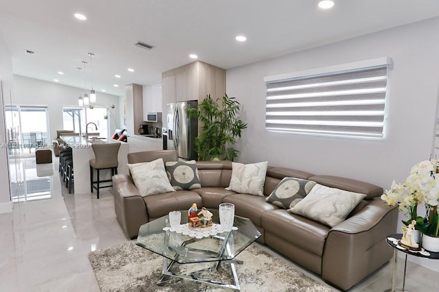 3813 SW 149th Pl, Miami, FL 33185 - living area with recessed lighting and light marble finish floors