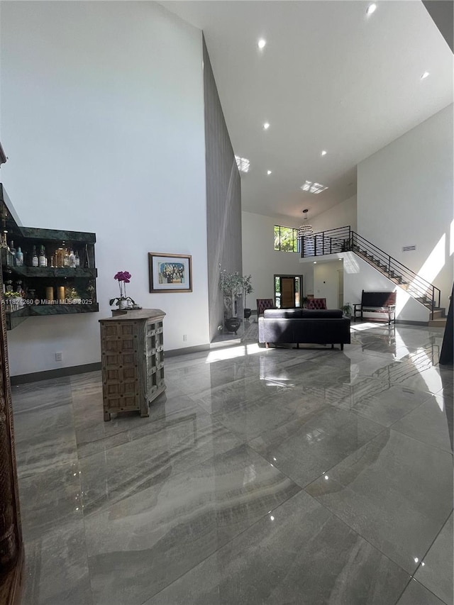 5811 SW 33rd Ter, Hollywood, FL 33312 - living room featuring a high ceiling, marble tiled floors, and recessed lighting