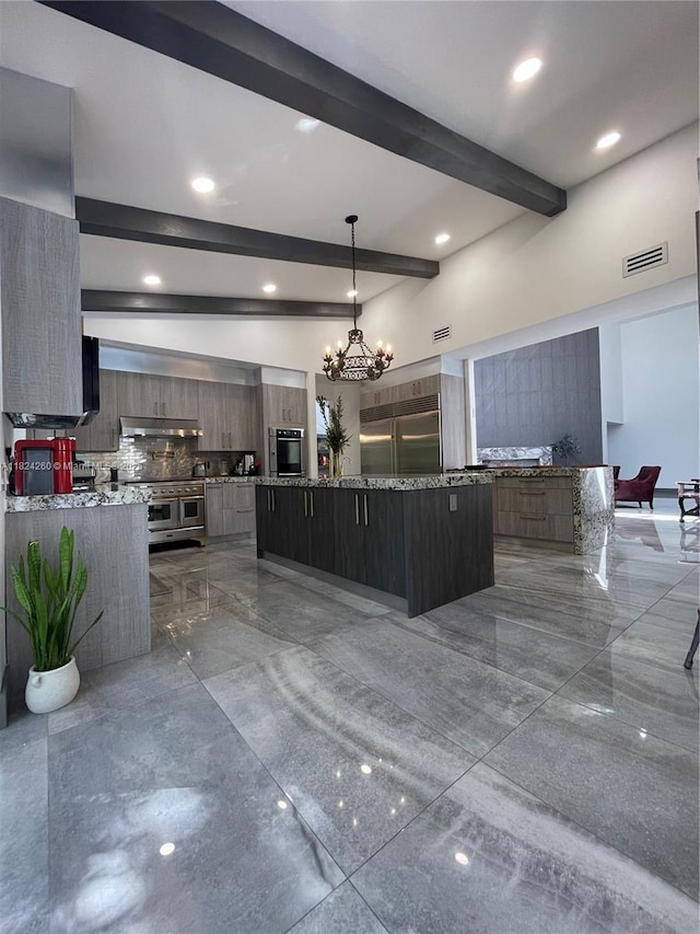 5811 SW 33rd Ter, Hollywood, FL 33312 - kitchen with modern cabinets, high end appliances, backsplash, beamed ceiling, and a chandelier