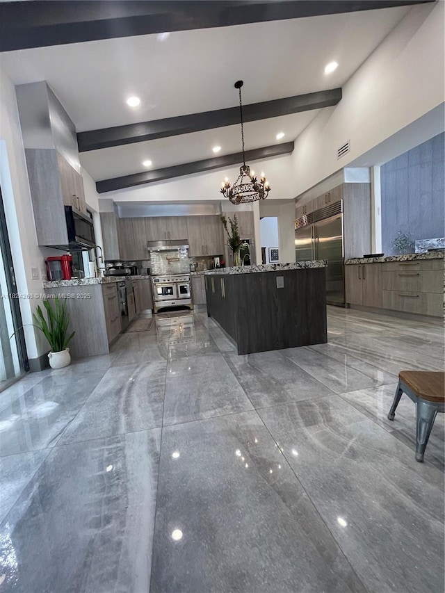 5811 SW 33rd Ter, Hollywood, FL 33312 - kitchen featuring high quality appliances, modern cabinets, a chandelier, decorative backsplash, and pendant lighting