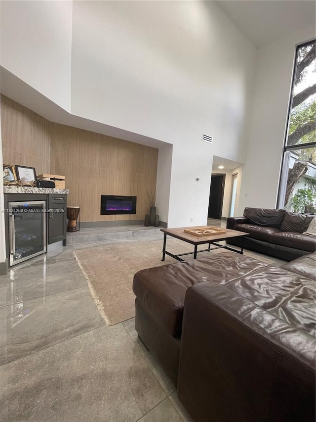 5811 SW 33rd Ter, Hollywood, FL 33312 - bedroom featuring a towering ceiling and a warm lit fireplace