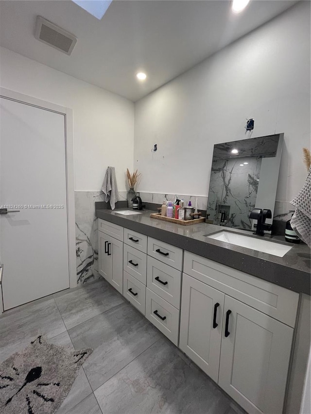 5811 SW 33rd Ter, Hollywood, FL 33312 - full bath featuring double vanity, a marble finish shower, recessed lighting, and a wainscoted wall