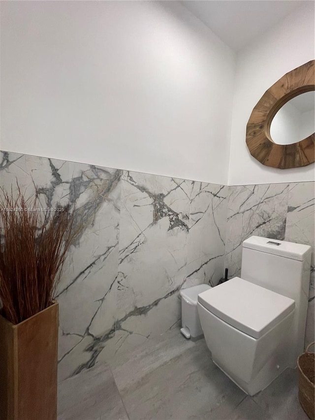 5811 SW 33rd Ter, Hollywood, FL 33312 - half bath featuring tile walls and a wainscoted wall