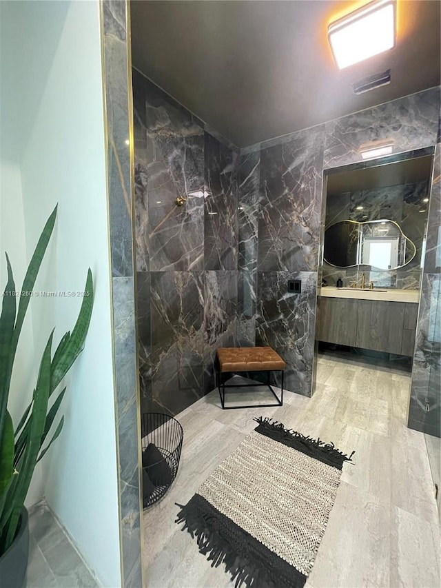 5811 SW 33rd Ter, Hollywood, FL 33312 - full bathroom with a marble finish shower, vanity, and tile walls