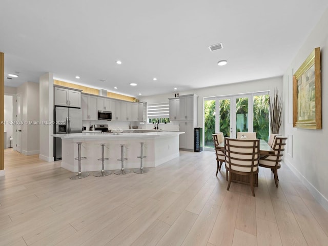 18100 SW 175th St, Miami, FL 33187 - kitchen featuring appliances with stainless steel finishes, gray cabinetry, light countertops, and recessed lighting