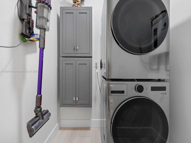 18100 SW 175th St, Miami, FL 33187 - washroom featuring stacked washer and clothes dryer and cabinet space