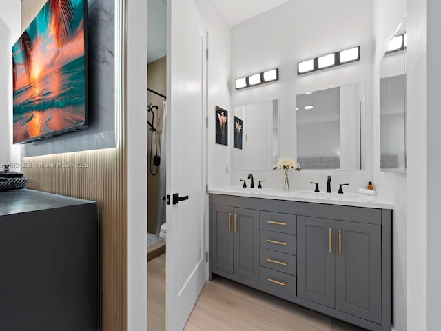 18100 SW 175th St, Miami, FL 33187 - bathroom featuring double vanity, wood finished floors, and a shower