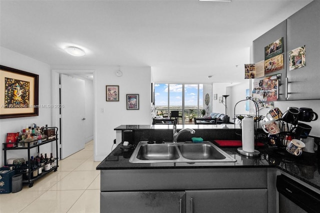 1861 NW S River Dr Unit Ph-01, Miami, FL 33125 - kitchen featuring dark countertops, light tile patterned floors, a peninsula, dishwashing machine, and expansive windows
