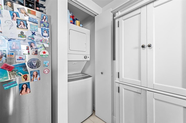 1861 NW S River Dr Unit Ph-01, Miami, FL 33125 - laundry area featuring stacked washer and clothes dryer and light tile patterned flooring