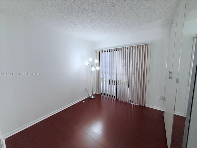 9352 S Belfort Cir Unit 109, Tamarac, FL 33321 - empty room featuring wood finished floors and a textured ceiling