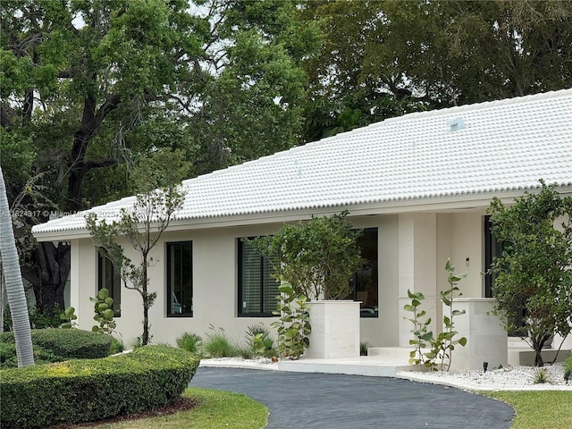 8845 SW 176th Ter, Palmetto Bay, FL 33157 - view of front of property with stucco siding, driveway, and a tile roof