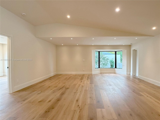 8845 SW 176th Ter, Palmetto Bay, FL 33157 - empty room featuring light wood-style floors, recessed lighting, a smoke detector, and vaulted ceiling