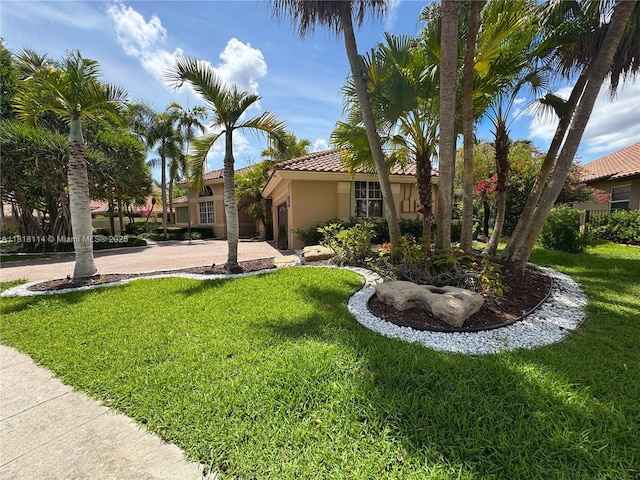 375 Sabal Way, Weston, FL 33326 - view of front of property with a tile roof, stucco siding, and a front lawn