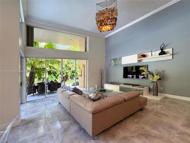 375 Sabal Way, Weston, FL 33326 - living area featuring ornamental molding, a high ceiling, and a textured ceiling