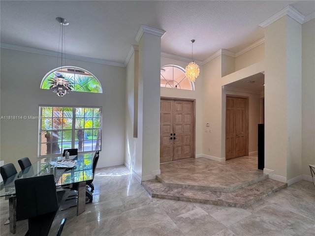 375 Sabal Way, Weston, FL 33326 - entryway with a chandelier, marble tiled floors, crown molding, and a high ceiling