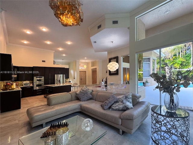 375 Sabal Way, Weston, FL 33326 - living room with ornamental molding and a chandelier